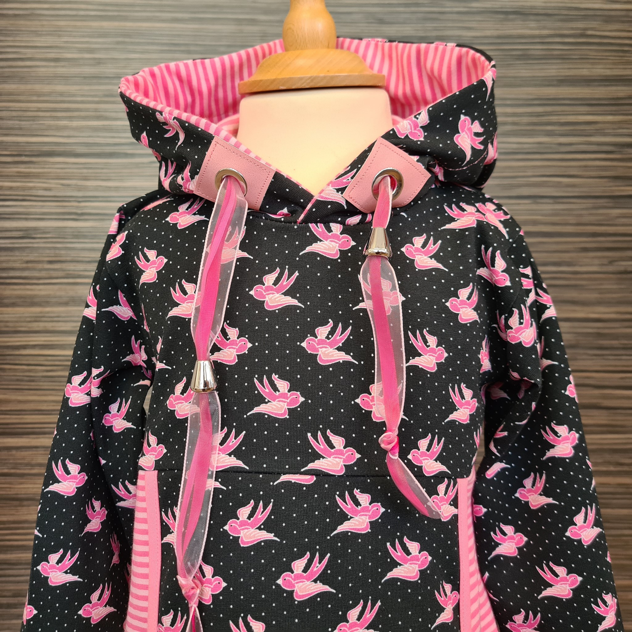 Bild von Kinderpulli schwarz pink